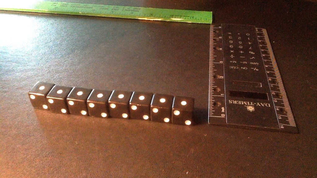 8 black dice in identical final orientation in a row