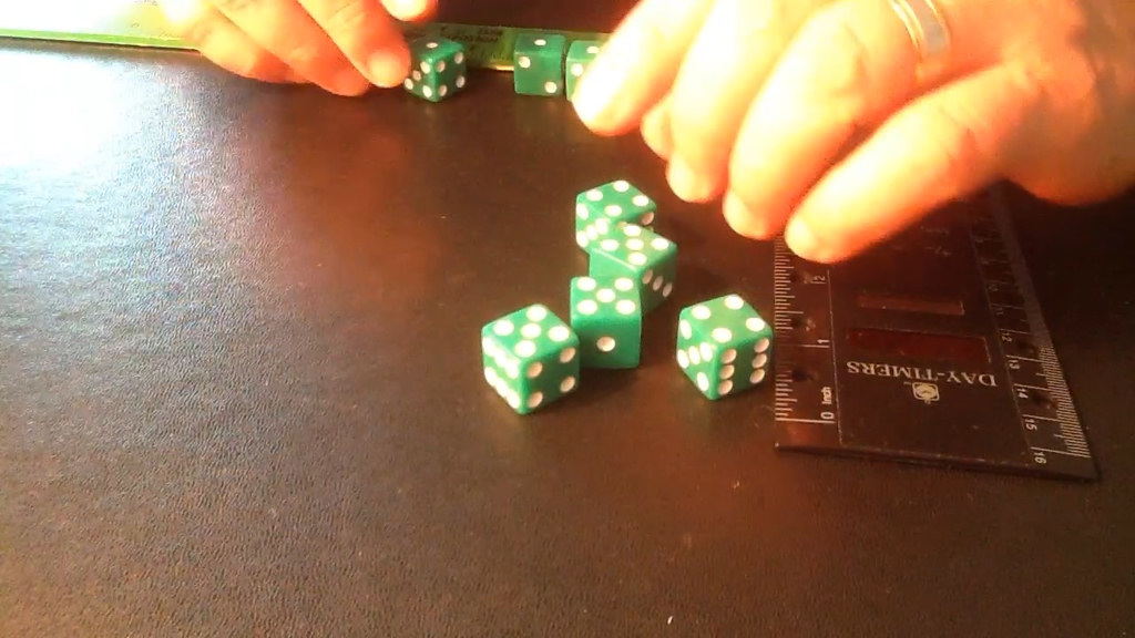 8 green dice in varied starting orientations, hands positioning